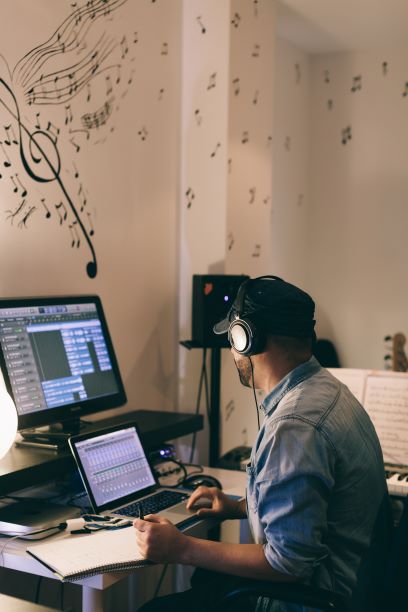 music creator looking at his computer