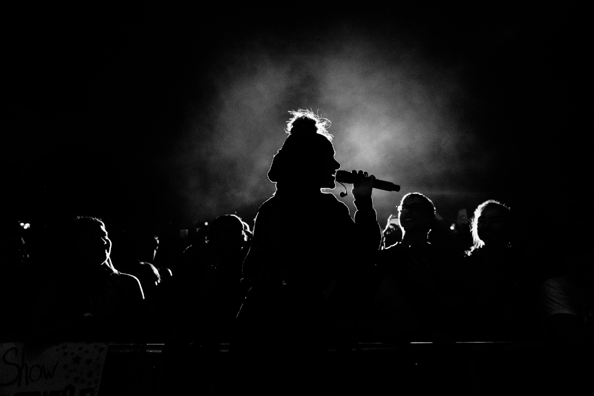 singer's silhouette singing on stage