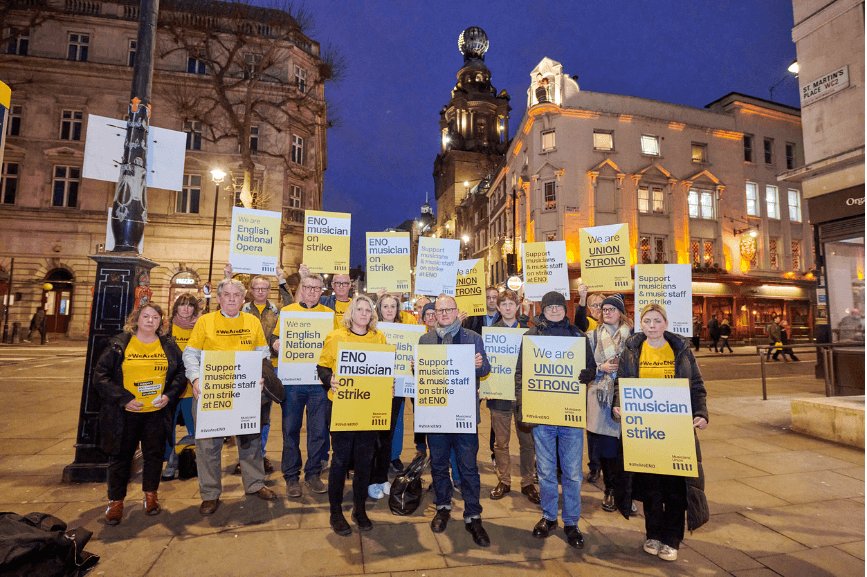 English National Opera members holding placards. Photo by Jonathan Stewart.