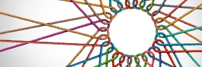 Multicoloured ropes connected to one another in a circle, representing diverse collaboration.