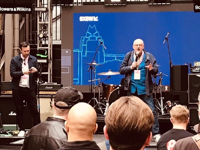 MU Head of International Dave Webster speaks on stage at a networking event that's part of SXSW