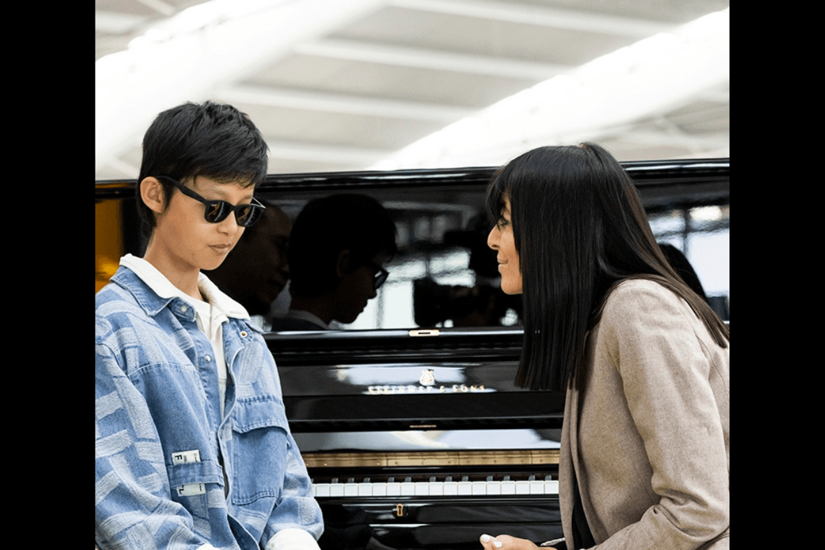 Chapman sat in front of a piano, talking to Claudia Winkleman on set for Channel Four’s show The Piano.