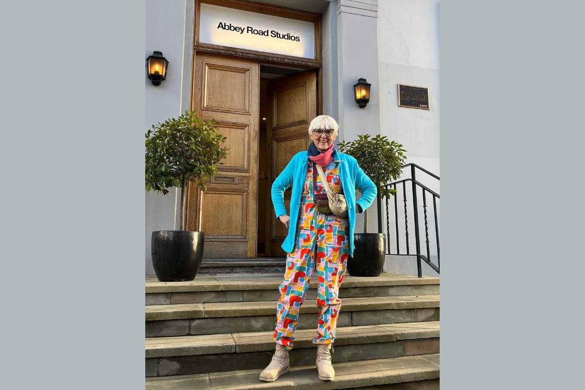 A more recent picture of Jill Streater smiling outside of Abbey Road studios.