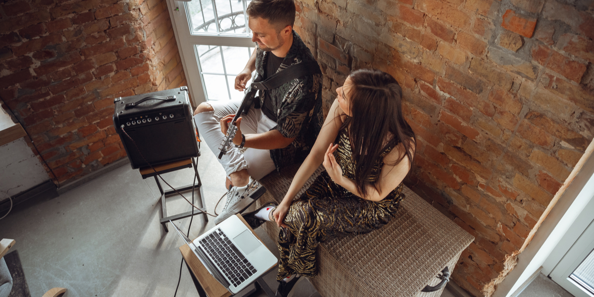 musicians playing guitar and singing during online concert at home