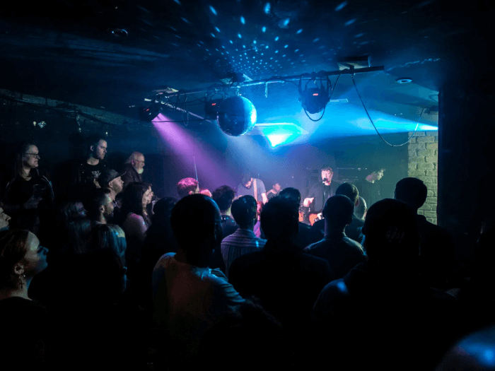 A band playing on stage at The Hug and Pint.