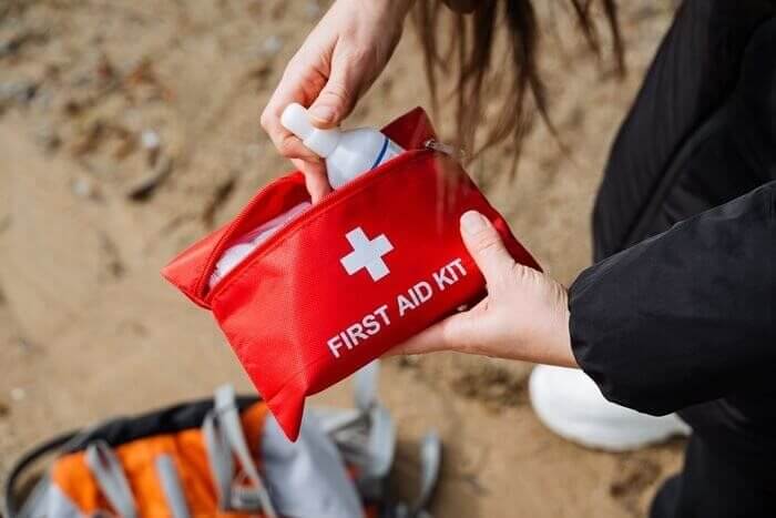 Person opening a first aid kit as part of training.
