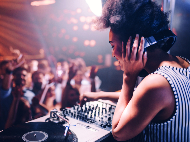 woman dj performing in front of the crowd