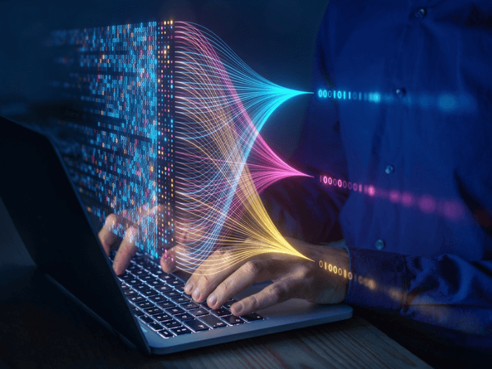 A scientist computing, analysing and visualising complex data set on computer.