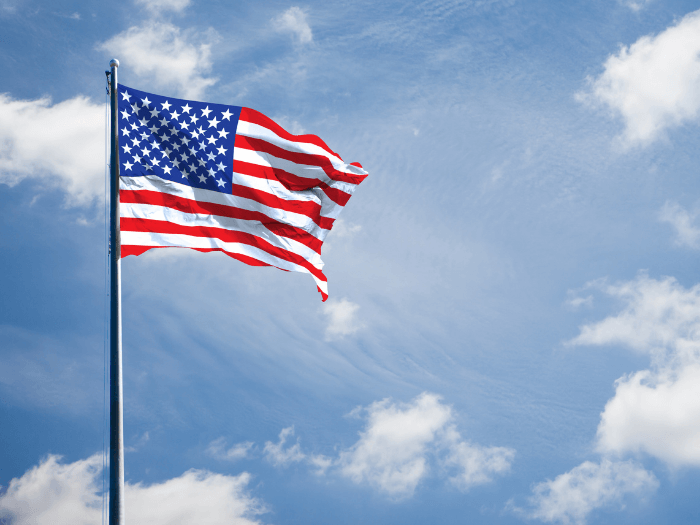 American flag against a blue sky.