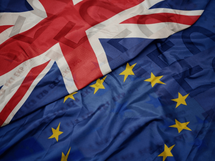 The European Union flag next to the national flag of Great Britain.