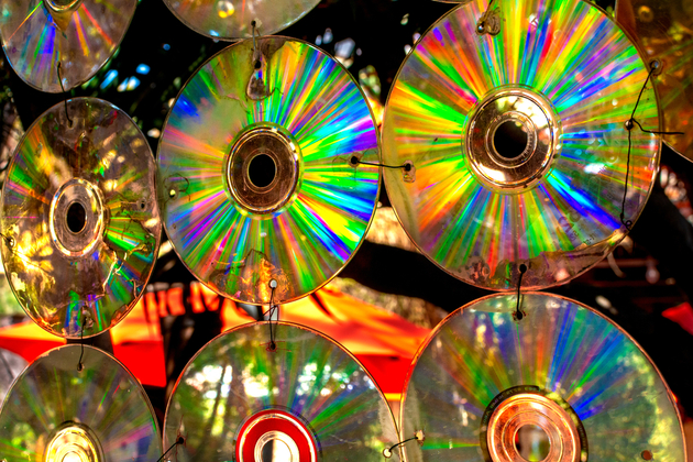 Photograph of a number of CDs threaded together and hung up as a beautiful decoration.