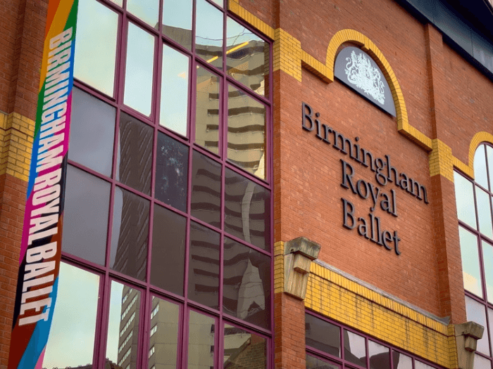 Close up of the exterior of the Birmingham Royal Ballet building with signage.