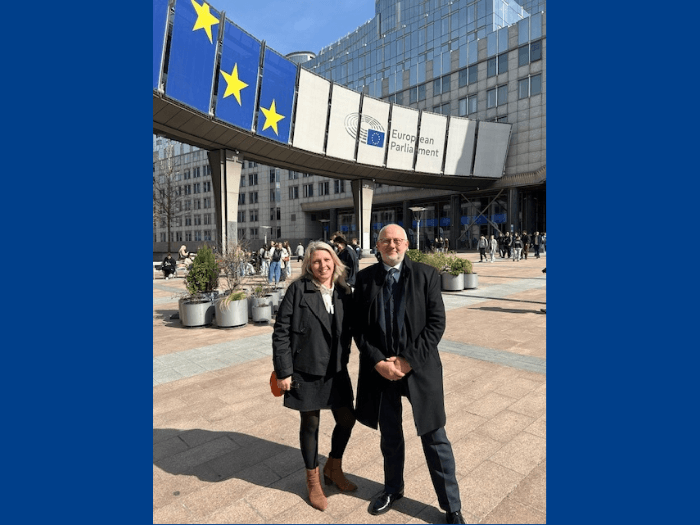 Naomi Pohl and Dave Webster outside the European Parliament building.