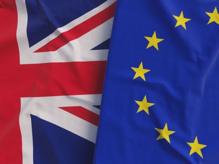 Flags of the United Kingdom and the European Union next to each other.