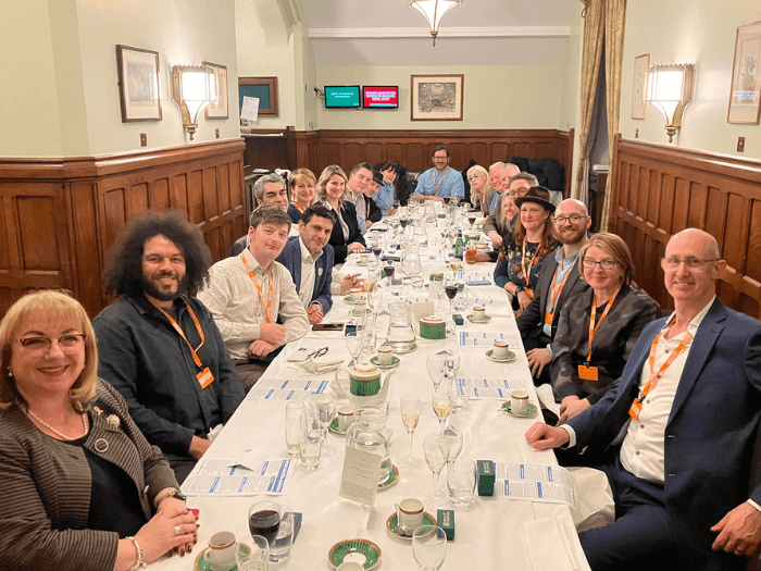 MPs and representatives from the CMM, sat along a table for dinner at Parliament, to discuss the Fix Streaming campaign.