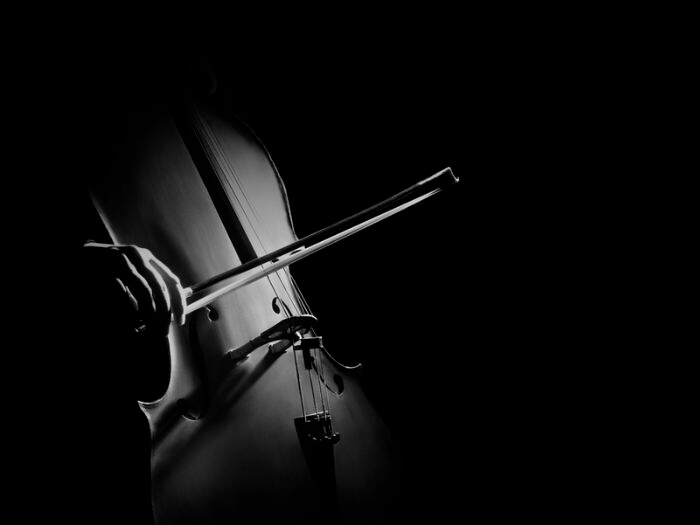 Close up of cello player in black and white.