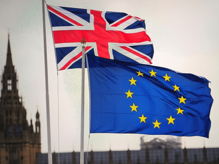 The UK flag flying next to the EU flag.
