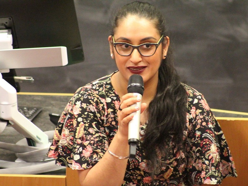 Photograph of MU Executive Committee Member Diljeet Bhachu, speaking into a microphone.