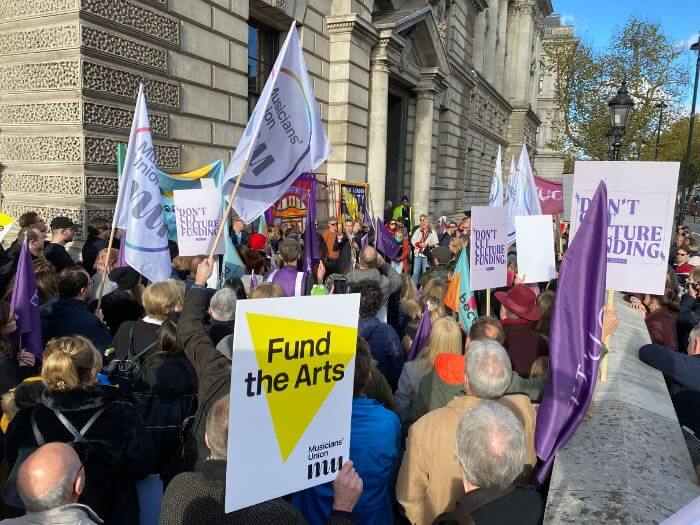 Arts funding cuts demo in front of the DCMS