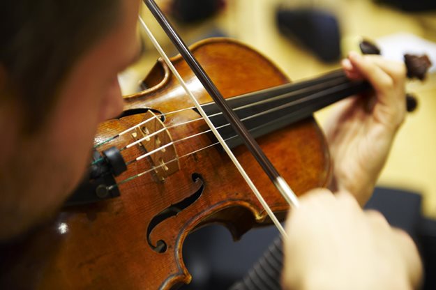 Close up image of Violin being played