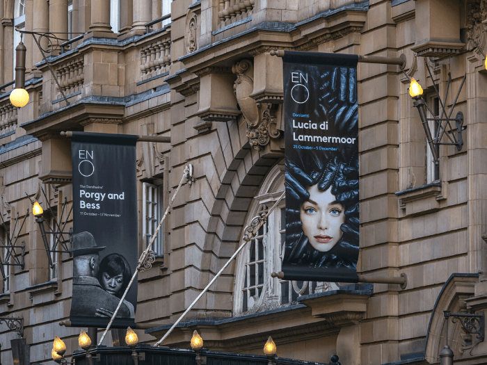 Banner signs outside the London Coliseum Theatre advertising performances of the English National Opera (ENO)