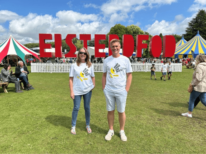 Ruth and Andy at last year’s event, in front of the large Eisteddfod sign.