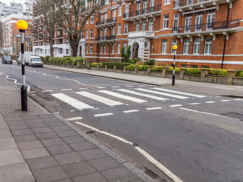 The famous Abbey Road crossing, with zebra crossing and day light.