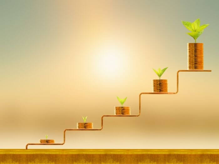 Piles of coins on successive steps.