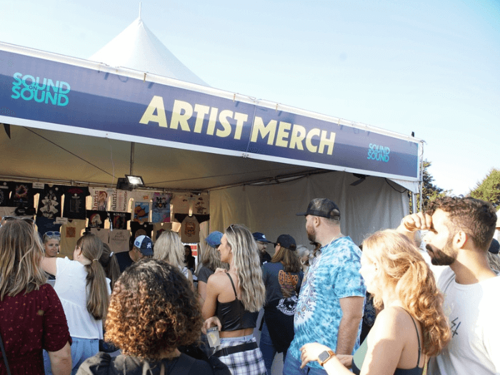 A merch stand at a music festival.