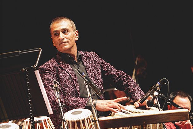 Kuljit Bhamra performing on stage