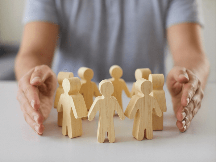 Wooden figures in a circle to represent equality.