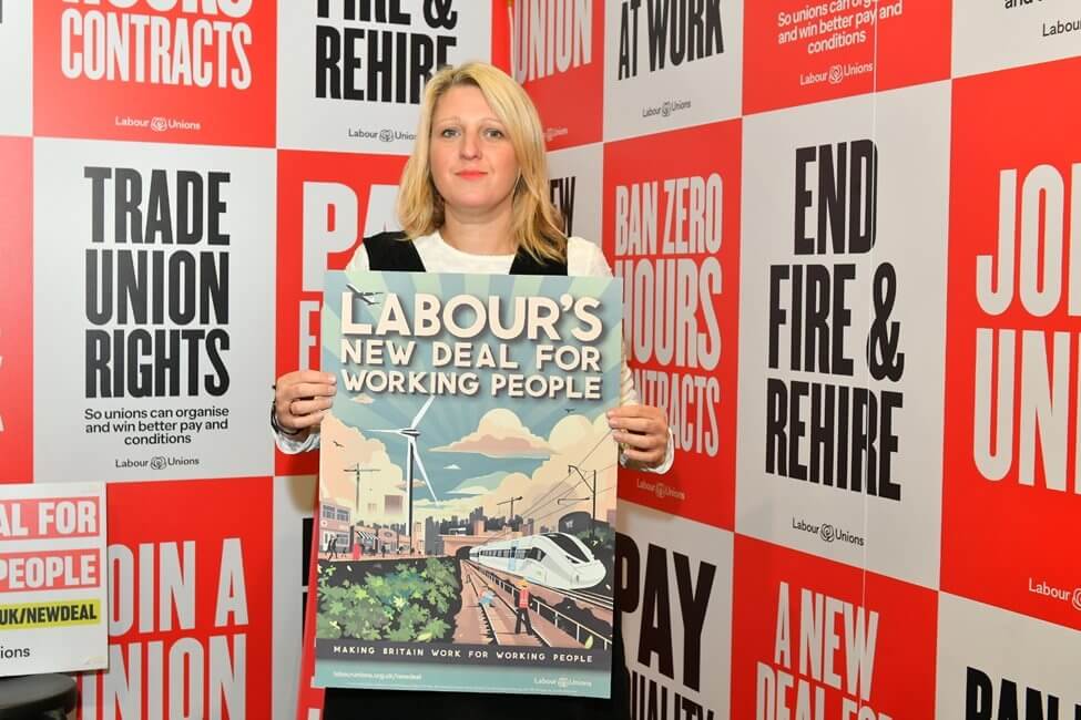 Naomi Pohl at Labour Party Conference 2024 holding a placard that says 'Labour's New Deal for Working People'.