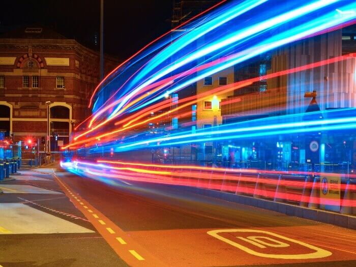 Liverpool Hood Street bus terminal at night, with long exposure of traffic trails/light of public transport.