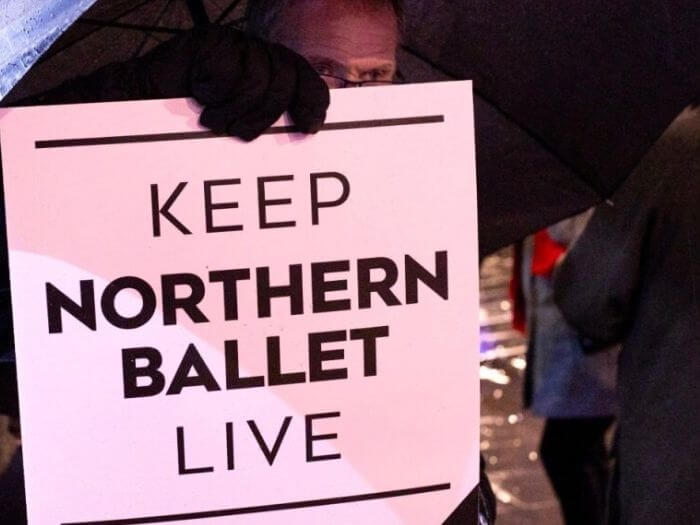 Person holding a 'Keep Northern Ballet Live' sign after a rally in late 2023.
