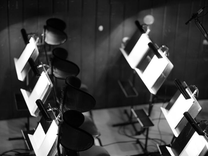 Orchestra pit, chairs and music stands in black and white.