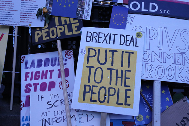 Protest signs reading 