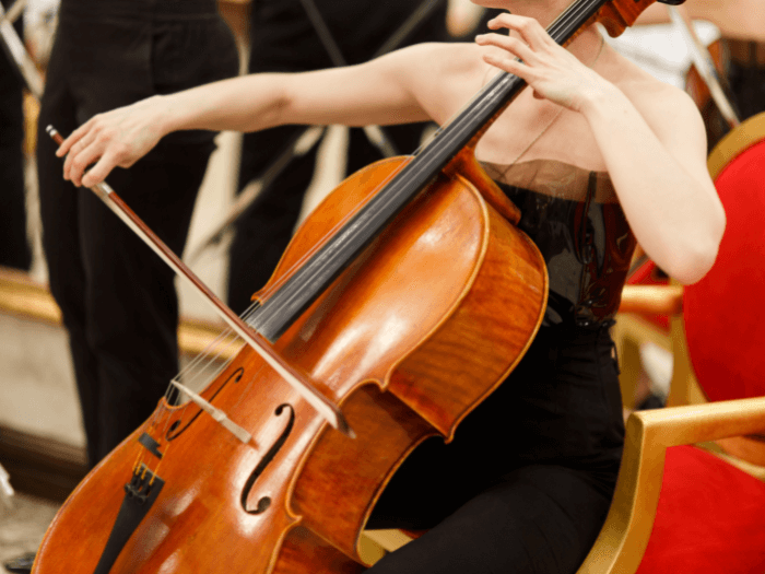 Close up of woman playing the cello.