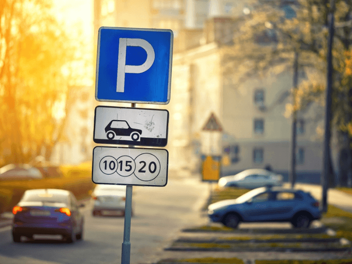 A parking sign in a residential area.