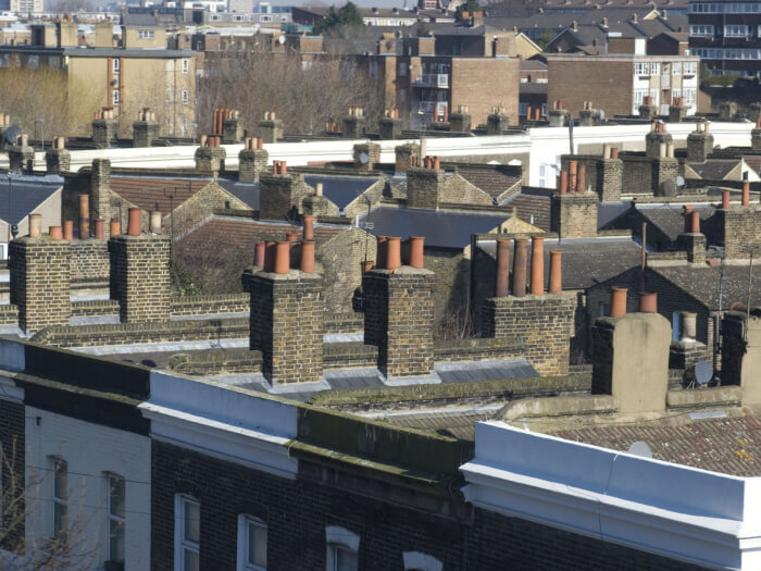 A view panning over rooftops indicating dense housing in an area of Lewisham.