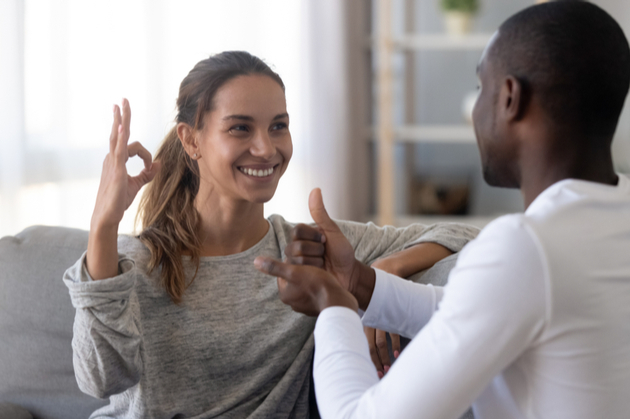 Two adults having a discussion in sign-language