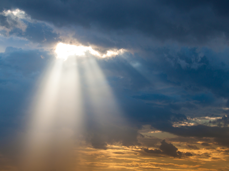 A beam of sunlight breaks through the clouds. Photo credit: Shutterstock