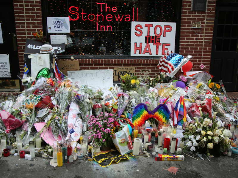 NEW YORK - JUNE 16, 2016: Memorial outside the gay rights landmark Stonewall Inn for the victims of the mass shooting in Pulse Club, Orlando in New York City