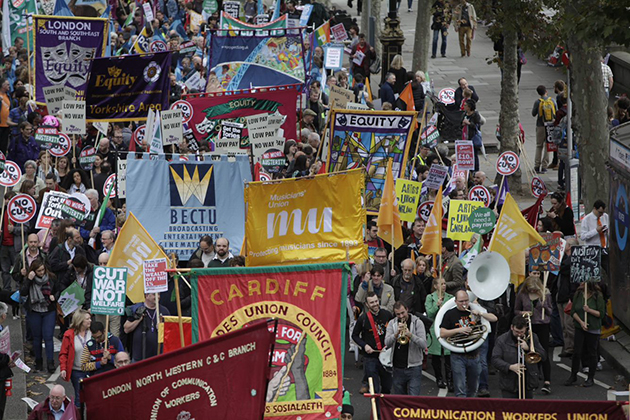 Photograph of different trade union banners being held aloft