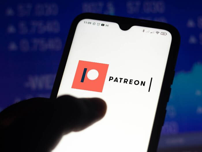 Someone using Patreon app. Shutterstock