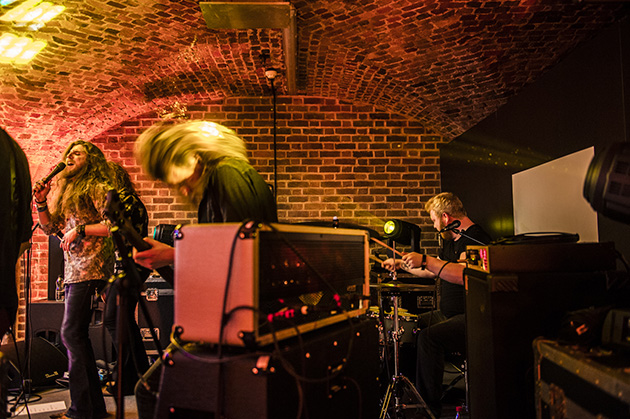 Photo of musicians playing in a gig setting