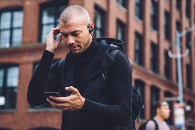 a man listening to music on his earphones