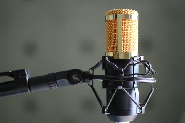 Image of studio microphone on red background