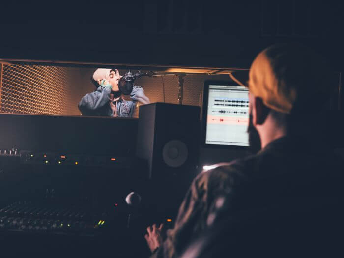 musicians recording in a studio