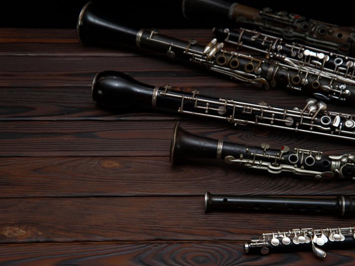 oboe instruments lying on a wooden floor